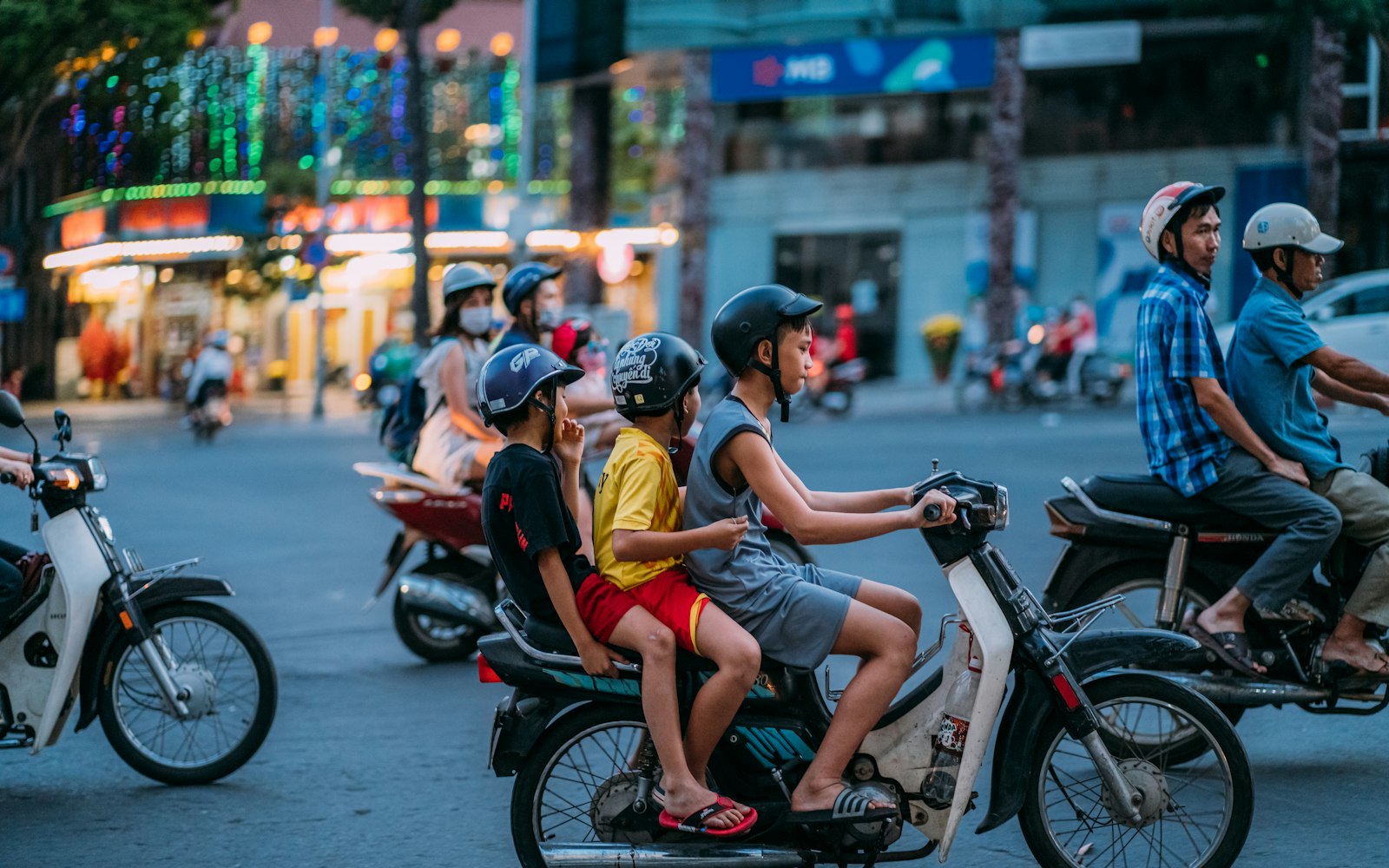 Motorbikes streaming through a busy District 1 street in Ho Chi Minh City, Vietnam