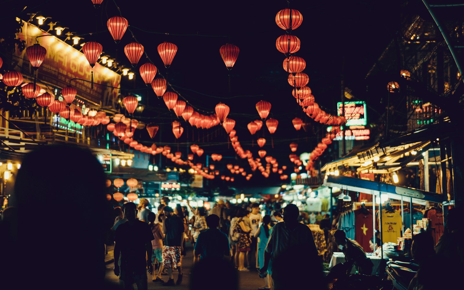 Silk lanterns glowing over the old town of Hoi An, Vietnam at night